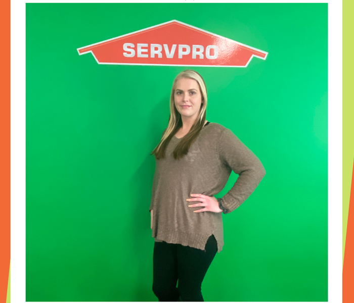 Photo of Allison - female employee in front of SERVPRO logo